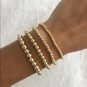 stacks of gold beaded bracelet set